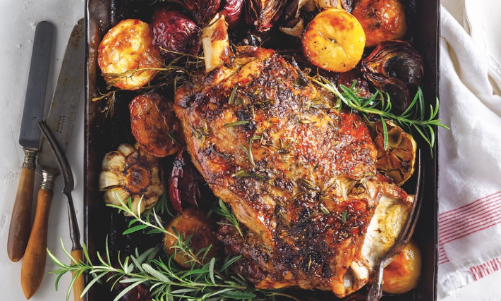 Slow-roasted lamb with garlic, red onions and maple potatoes